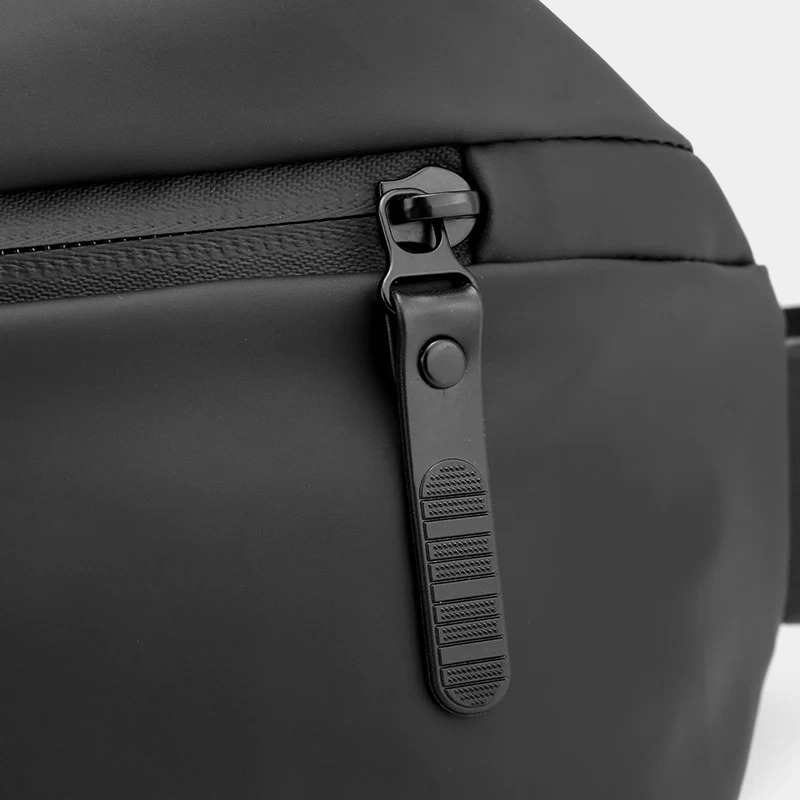 The Aviemore - The Aviemore nylon bum bag in black, close-up detail The Aviemore nylon bum bag in black, close-up detail