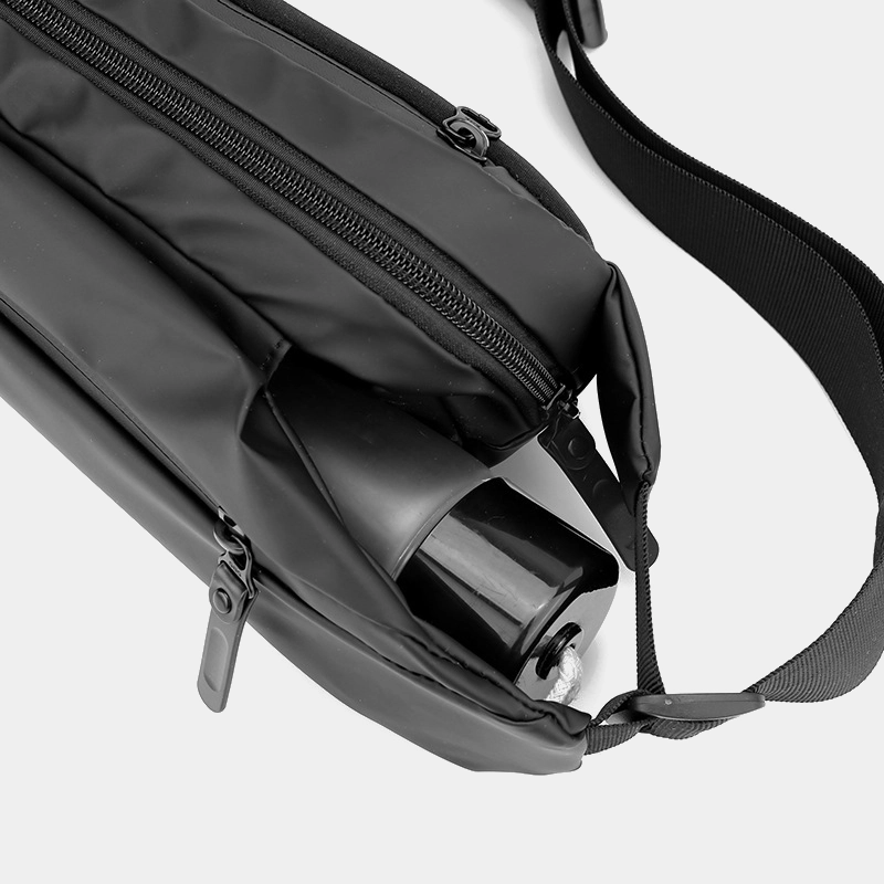 The Aviemore - The Aviemore nylon bum bag in black, with a folding umbrella in the back slot The Aviemore nylon bum bag in black, with a folding umbrella in the back slot
