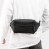 The Aviemore - The Aviemore nylon bum bag in black, worn round the waist The Aviemore nylon bum bag in black, worn round the waist