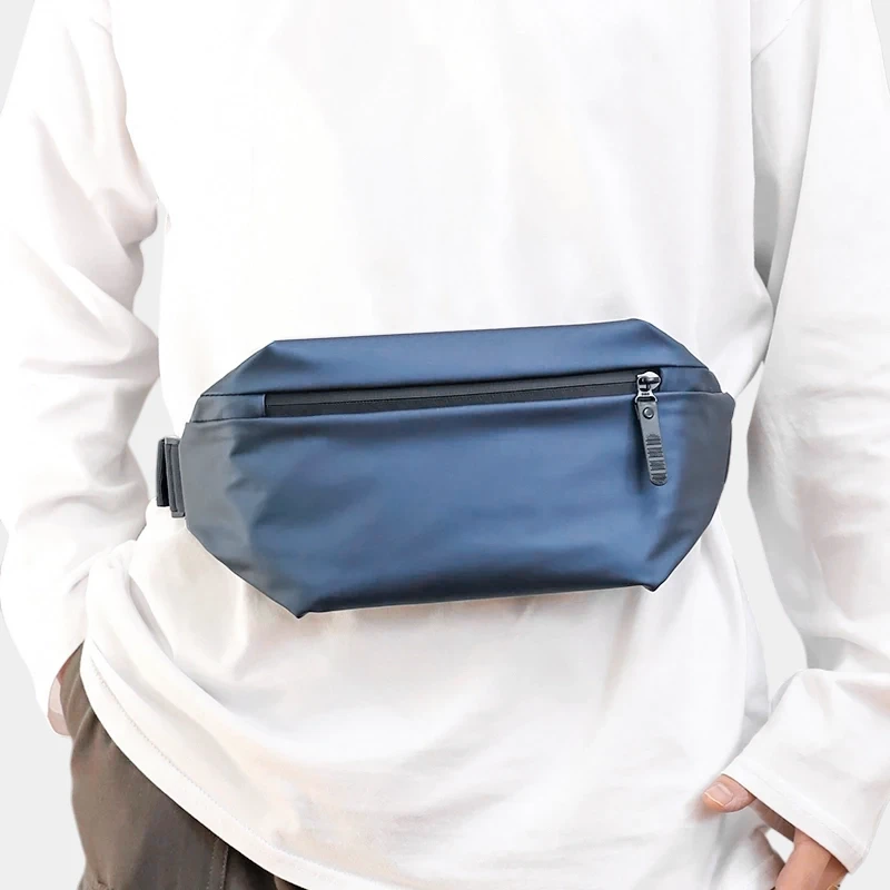 The Aviemore nylon bum bag in blue, worn round the waist