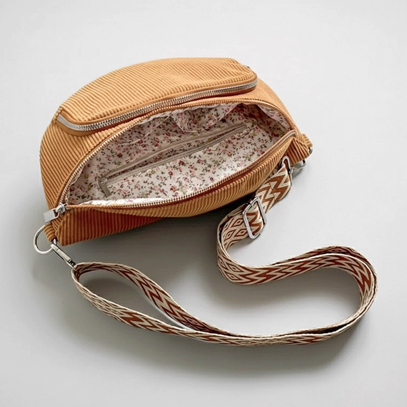 The Ilkley - Brown corduroy bum bag open to show the floral print lining Brown corduroy bum bag open to show the floral print lining
