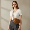 The Ilkley - Woman wearing the brown Ilkley corduroy bum bag across the body Woman wearing the brown Ilkley corduroy bum bag across the body