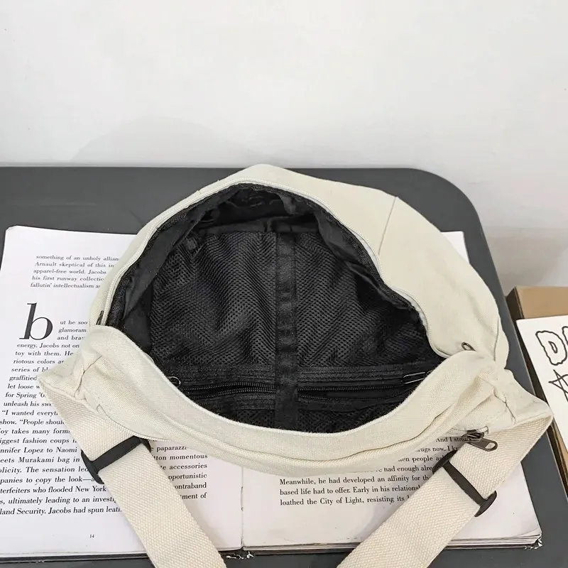 The Keswick canvas bum bag in beige, open to show the inside