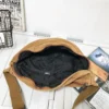 The Keswick - The Keswick canvas bum bag in brown, open to show the inside The Keswick canvas bum bag in brown, open to show the inside