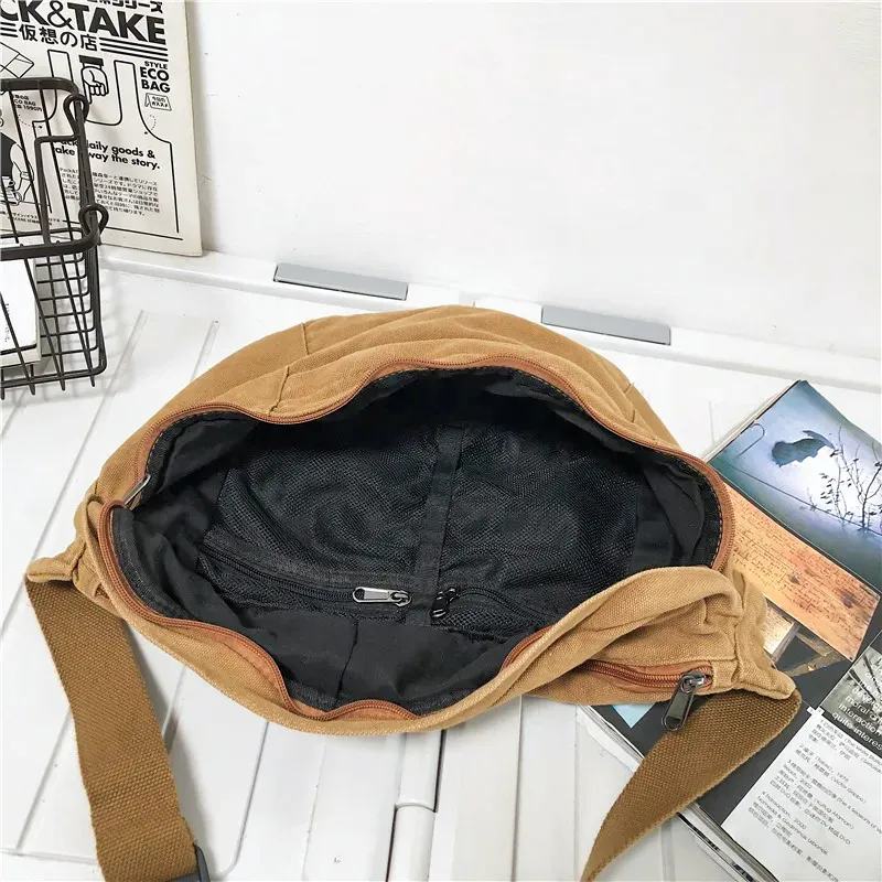 The Keswick - The Keswick canvas bum bag in brown, open to show the inside The Keswick canvas bum bag in brown, open to show the inside