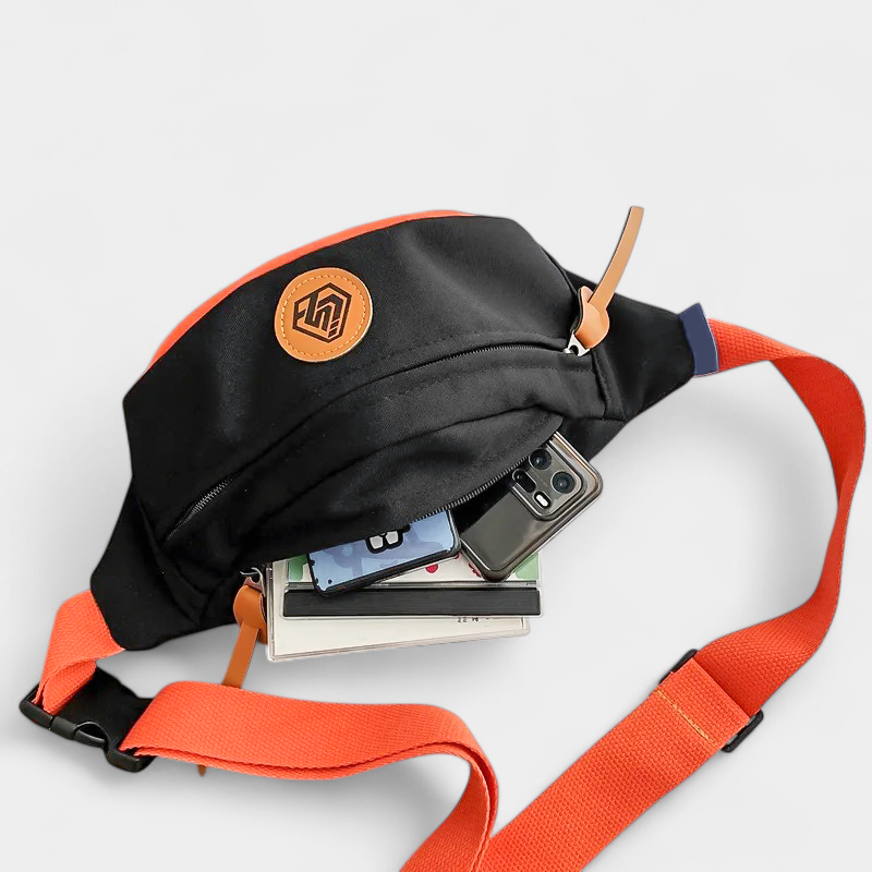 The Padstow two-tone belt bag in black, open to show the inside
