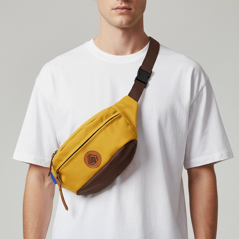 The Padstow two-tone belt bag in yellow, worn across the body
