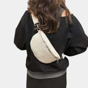 The Skipton corduroy bum bag in beige, worn across the body