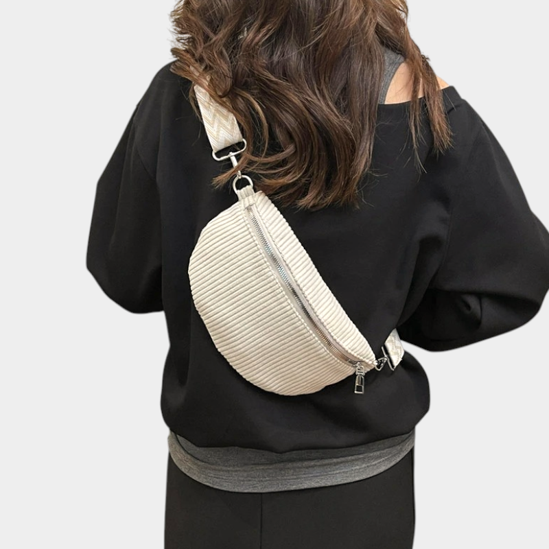 The Skipton corduroy bum bag in beige, worn across the body