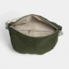 The Skipton corduroy bum bag in green, open to show the inside