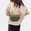 The Skipton corduroy bum bag in green, worn across the body